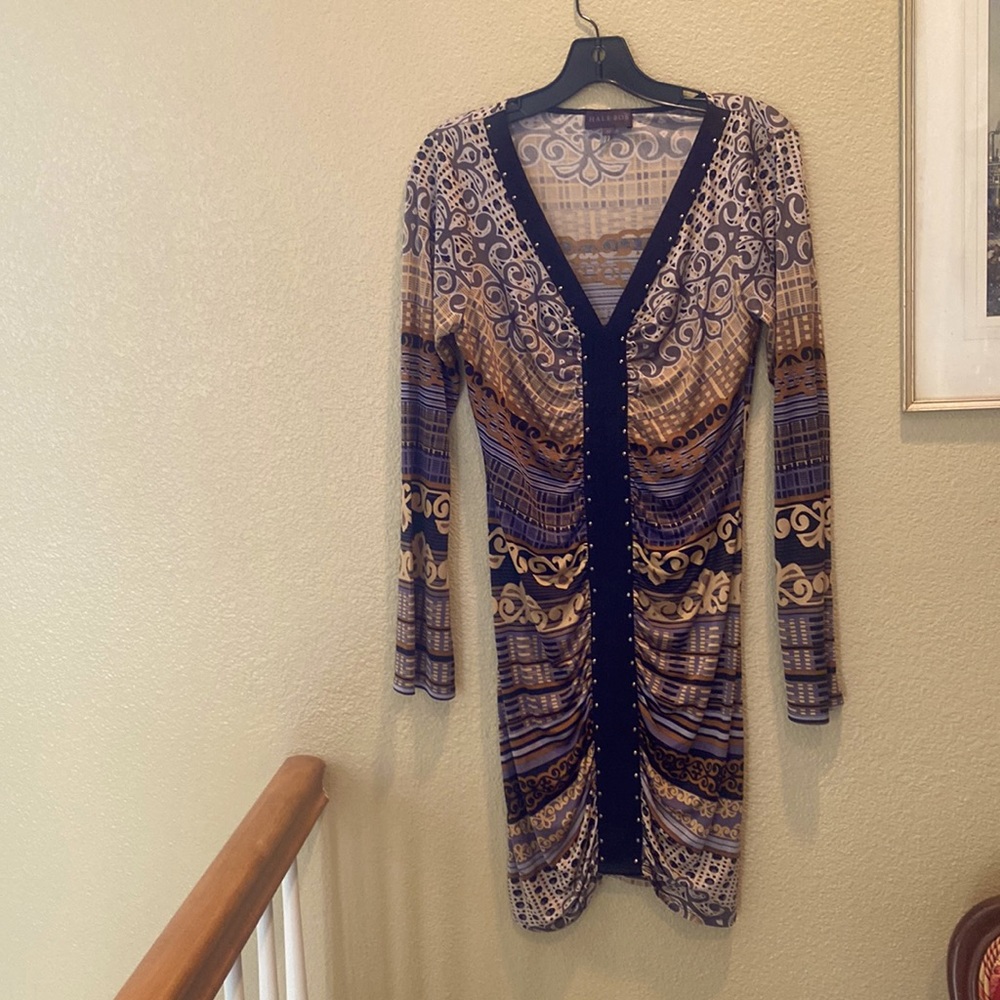 Hale Bob-long flare sleeve and cute sassy hemline. Form fitting. Tiny studs
